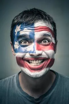 Funny man with us flag painted on face Stock Photos