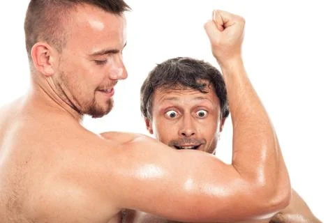 Funny men looking at biceps Stock Photos