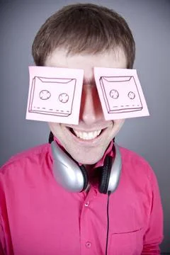 Funny men with notes and headphone. Stock Photos