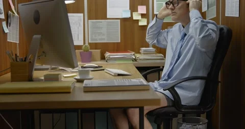 Funny messy office worker having a video call with no pants Stock Footage 308922984