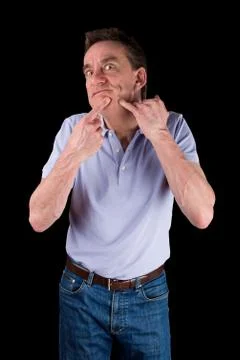 Funny middle age man squeezing face Foto stock