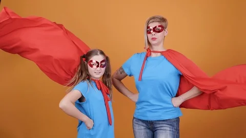 Funny moment while mom and daughter play superheroes Stock Footage 103357936