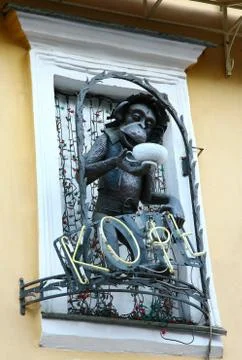 Funny monkey with cap of coffee decorated window in cafe nizhny novgorod Stock Photos