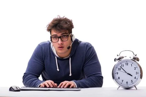 Funny nerd call center operator with giant clock Foto stock