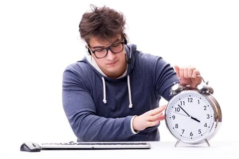 Funny nerd call center operator with giant clock Foto stock