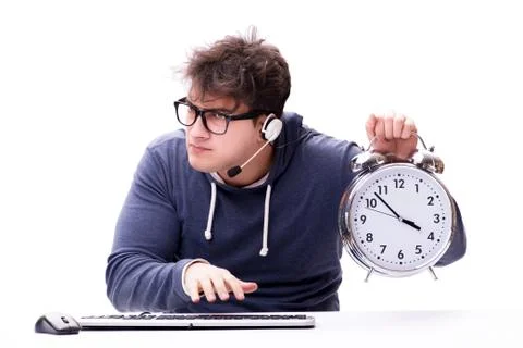 Funny nerd call center operator with giant clock Stock Photos