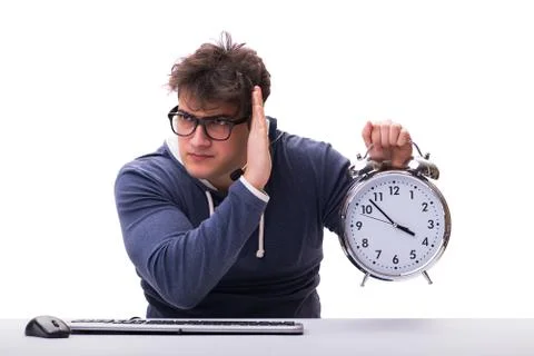 Funny nerd call center operator with giant clock Foto stock