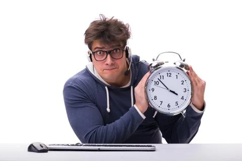 Funny nerd call center operator with giant clock Foto stock