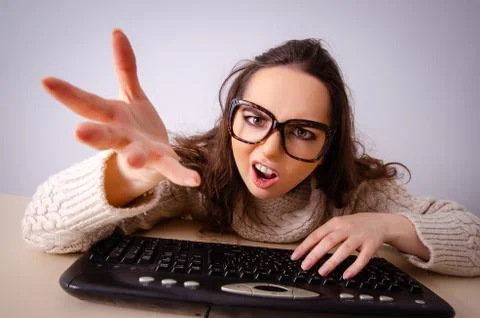 Funny nerd girl working on computer Stockfoto's