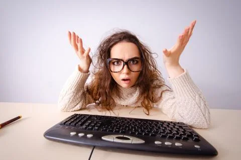 Funny nerd girl working on computer Stock Photos