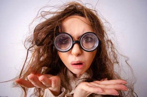 Funny nerd girl working on computer 스톡 사진