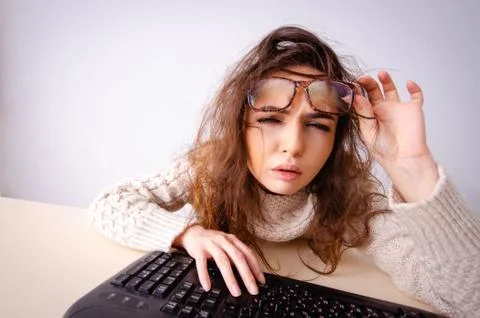 Funny nerd girl working on computer 스톡 사진