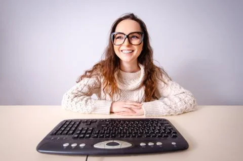 The funny nerd girl working on computer 写真素材