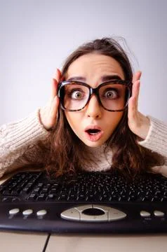 The funny nerd girl working on computer 스톡 사진