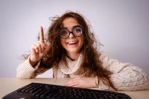 The funny nerd girl working on computer Foto stock
