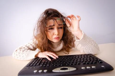 Funny nerd girl working on computer Foto stock