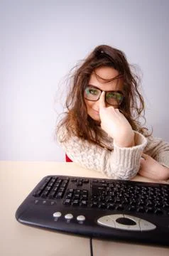 Funny nerd girl working on computer 写真素材