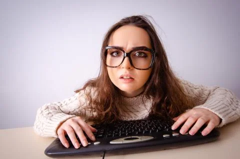 Funny nerd girl working on computer 스톡 사진