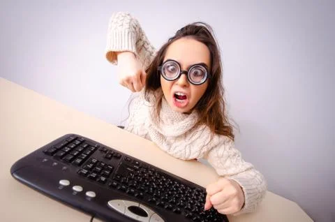 Funny nerd girl working on computer Stockfoto's