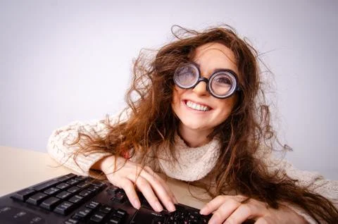Funny nerd girl working on computer 스톡 사진