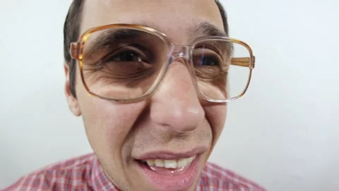 Funny nerd in glasses squints to see better Stock Footage 131171692