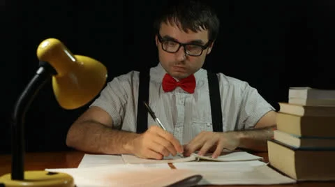 Funny nerd man writing at night Stock Footage 22606577