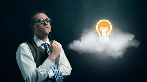Funny nerd or geek looking to flying cloud with rotating light bulb icon Video stock 104183163