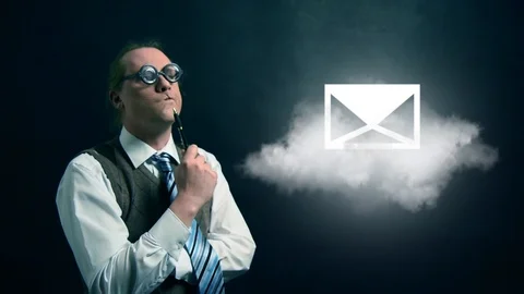 Funny nerd or geek looking to flying cloud with rotating mail icon Stock Footage 104186262