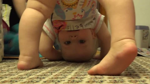 Funny Newborn in Headstand Posture. Closeup. 4K UltraHD, UHD Vídeos de archivo 61102706