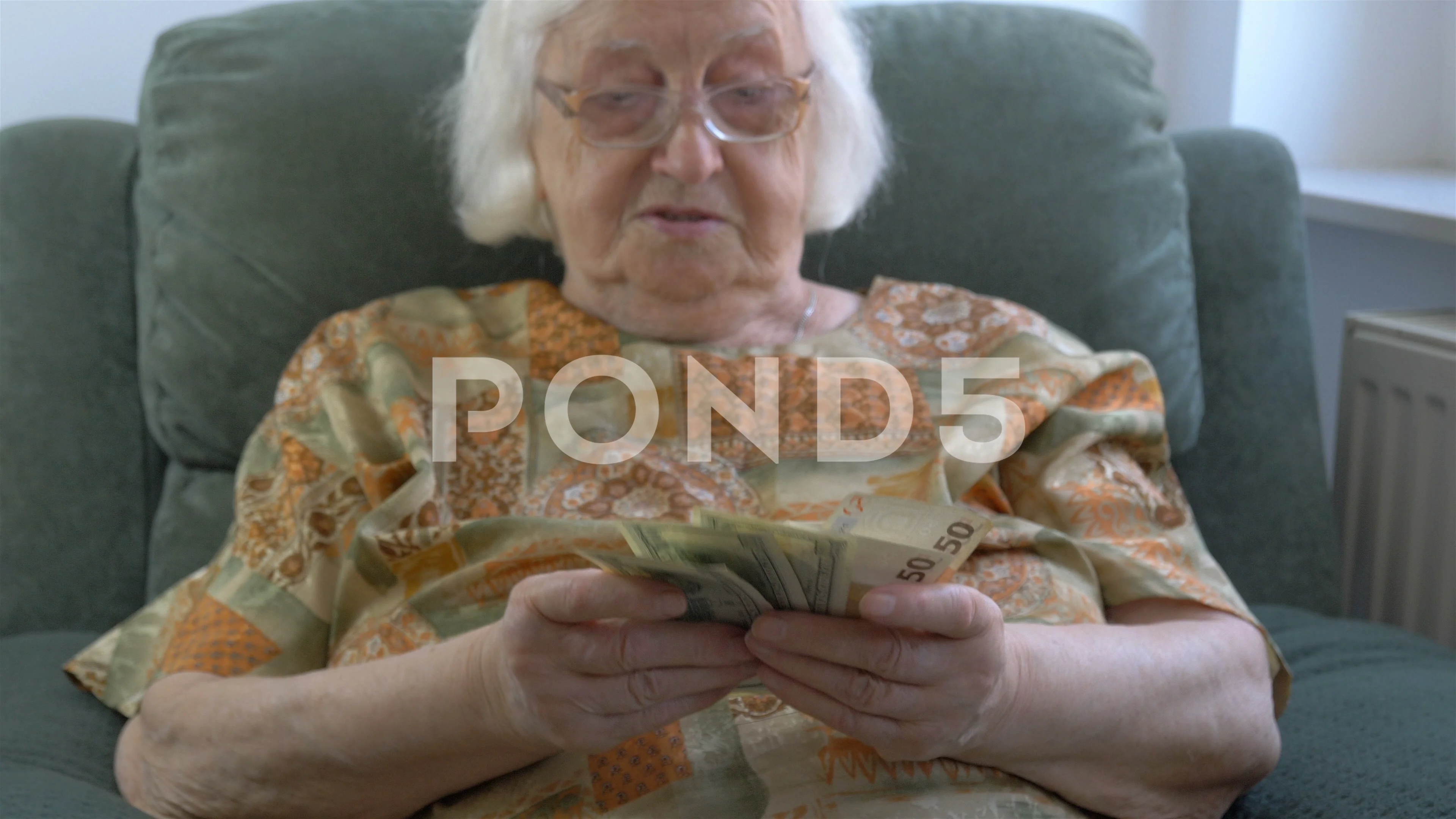 Funny old lady is counting money. Rich e... | Stock Video | Pond5