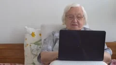 Funny old lady with a smartphone | Stock Video | Pond5