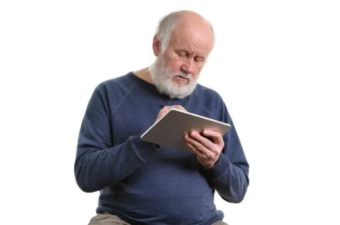 Funny old man using tablet computer isolated on white Stock Photos