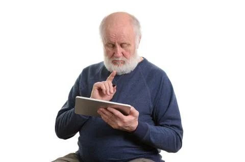 Funny old man using tablet computer isolated on white Stock Photos