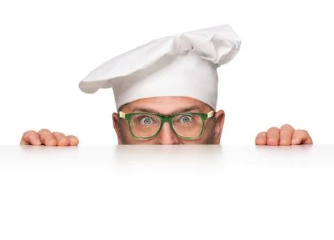 Funny overweight chef peeking from behind the banner isolated on white Stock Photos