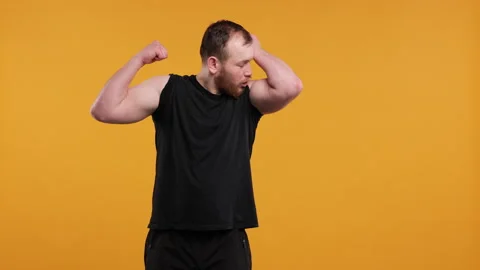 Funny Overweight Man Posing in Gym Stock Footage 275853798