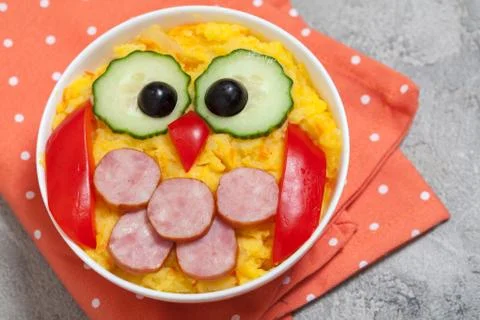 Funny owl mashed potato vegetable puree with sausage for kids lunch Stock Photos