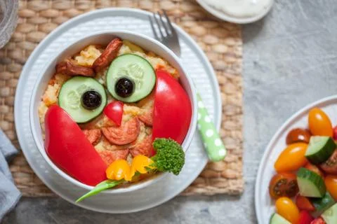 Funny owl mashed potato vegetable puree with sausage for kids lunch Stock Photos