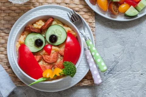 Funny owl mashed potato vegetable puree with sausage for kids lunch Stock Photos