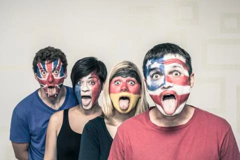 Funny people with flags on faces Stock Photos