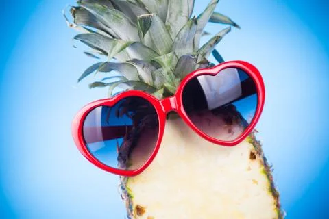 Funny pineapple in a sunglasses Stock Photos