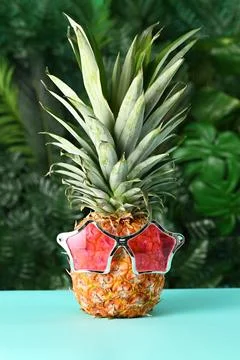 Funny pineapple with sunglasses Stock Photos