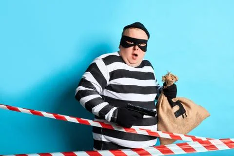 Funny plump offender with surprised exression posing to the camera Stock Photos