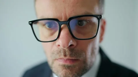 Funny portrait of a formally dressed man grimaces and looks at the camera 스톡 동영상 211725255