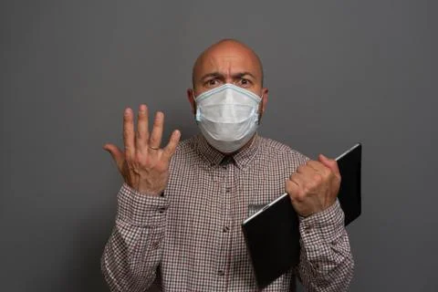 Funny Portrait of a keep working bearded man with tablet in hands in a gauze  Stock Photos