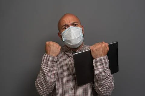 Funny Portrait of a keep working bearded man with tablet in hands in a gauze  Stock Photos