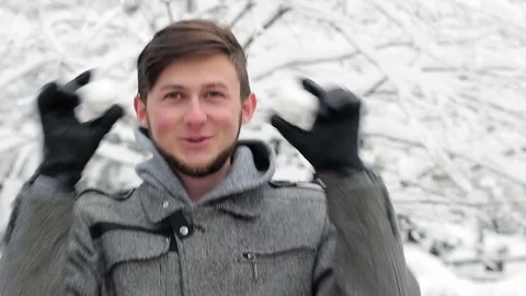 Funny positive man having fun in the winter park Stock Footage 82705238