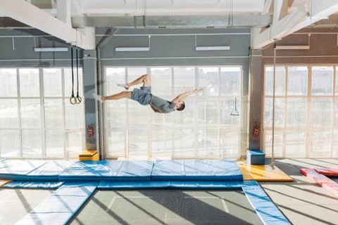 Funny posture d turing the jumping on the trampoline Stock Photos
