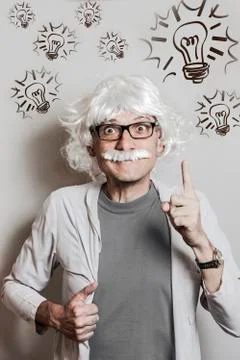 Funny Professor scientist like Einstein got the idea Stock Photos