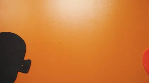 Funny pumpkin rolls flips on orange background, stop motion. Halloween concept 库存影片 278690016