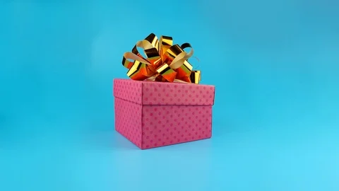 Funny rabbit gets out from gift box, blue background ready for chroma key Stock Footage 96676776